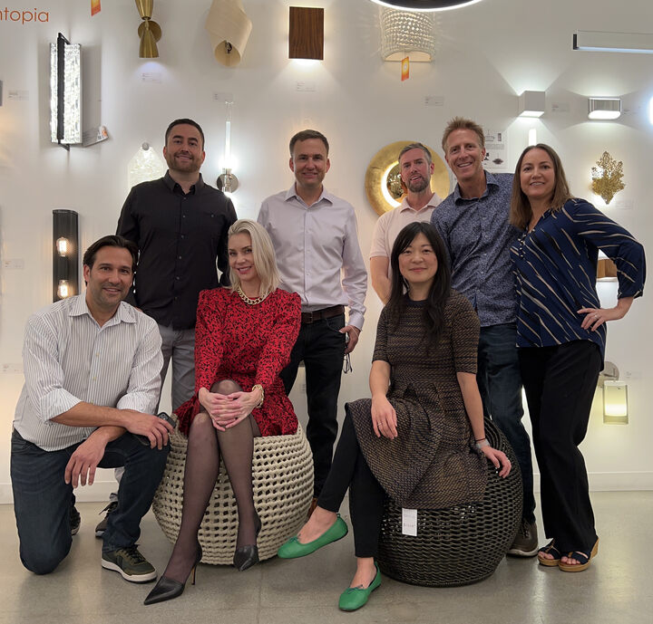 Photo of rugs direct and lightopia team in showroom