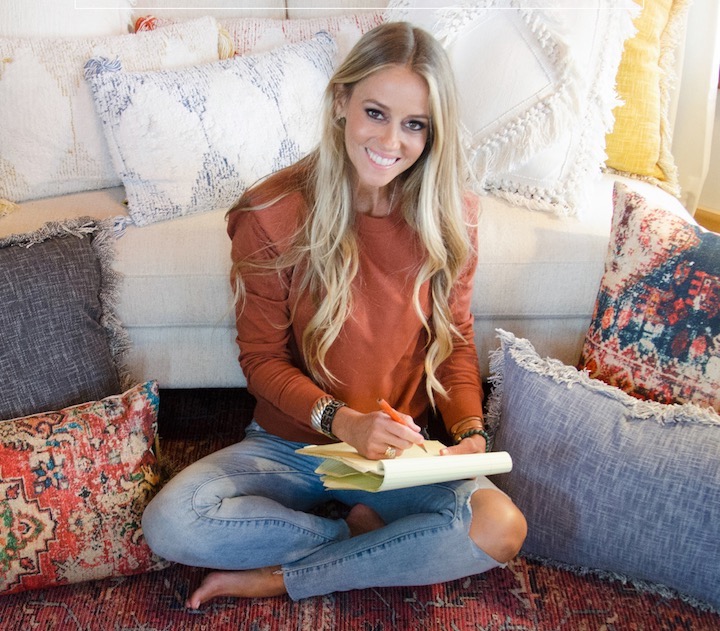 rehab addict star Nicole Curtis sitting in a living room with her rug
