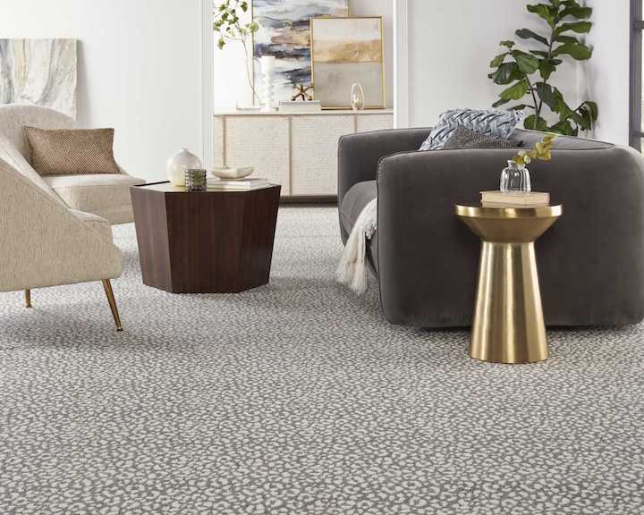 a Nourison leopard print styled broadloom carpet in living room