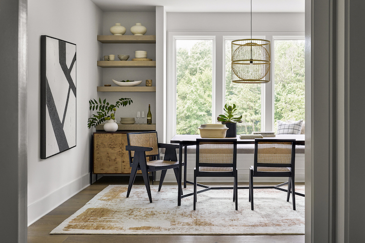 a Surya room setting featuring new dining furniture and area rug