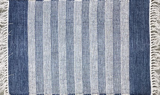 blue and white fringed rug