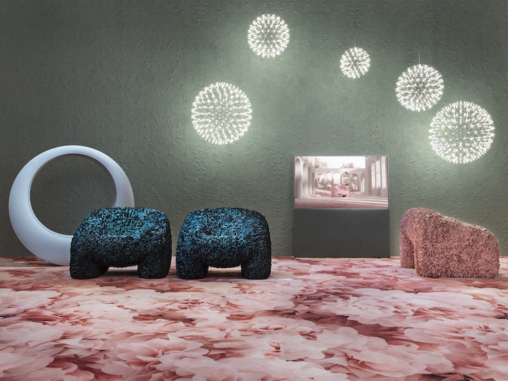 a room featuring flower bloom arm chair and carpet by Moooi