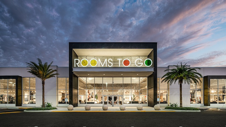 Rooms To Go store exterior at dusk