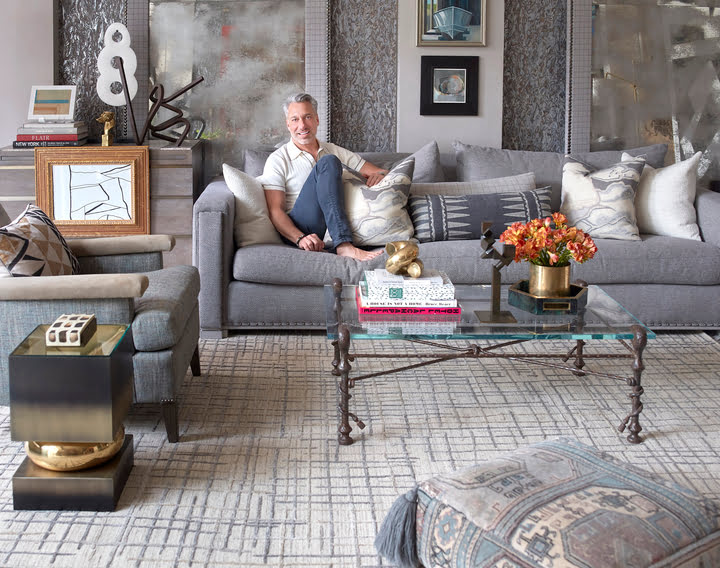 Designer Thom filicia in his living room with his new area rug design