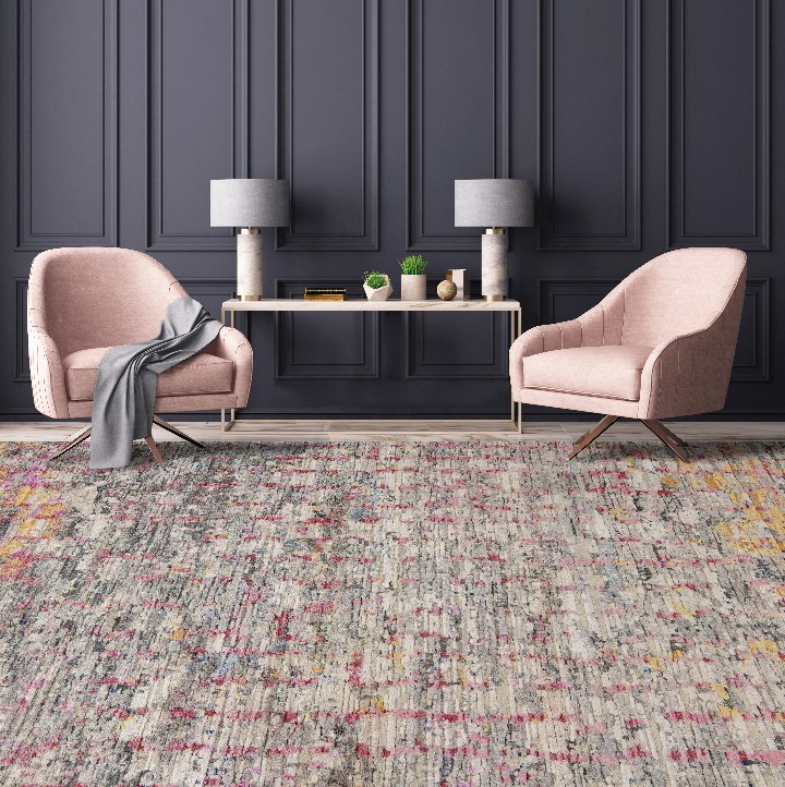 room with coral and gray multi color abstract rug