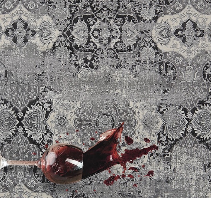 Wine being spilled on rug