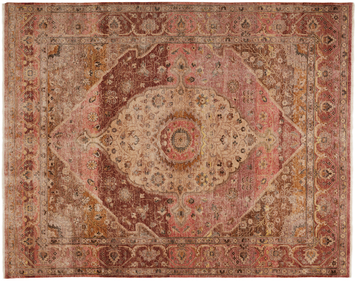 A rust and tan rug with an intricate pattern