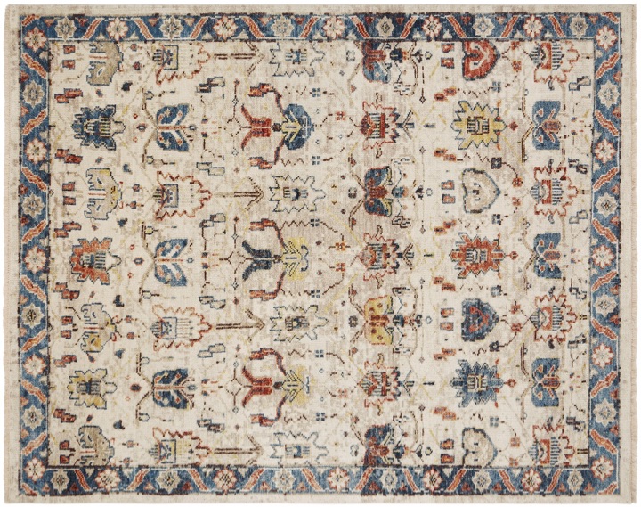 classic motif rug in creams, dark blues and rusts