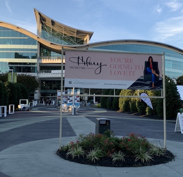 image of high point building exterior with billboard of Hilary Farr