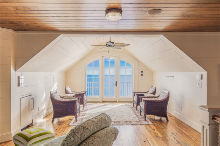 image of a shaped seating area with traditional styled area rug in neutral tones