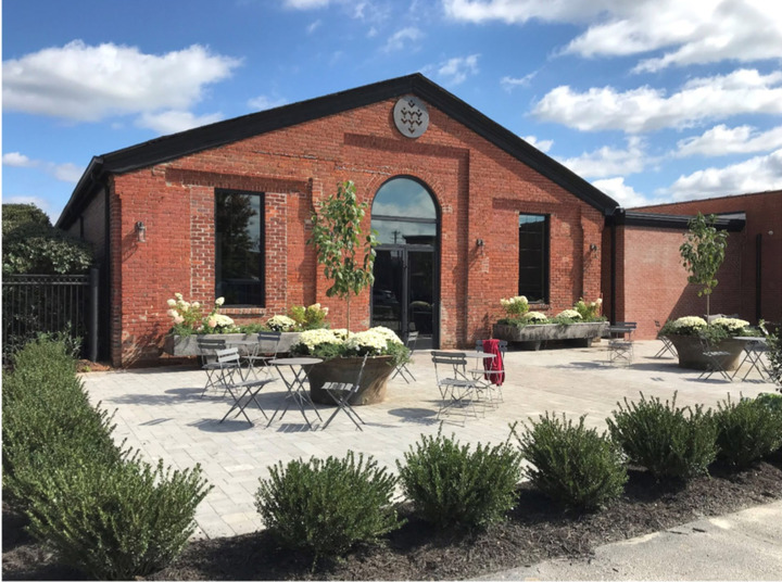 brick showroom exterior with patio