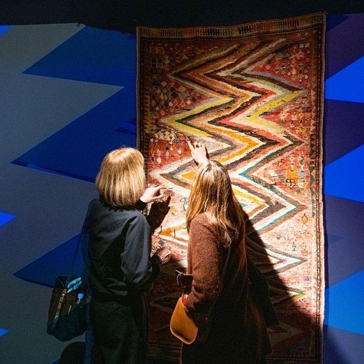 image of rug shoppers looking at rug