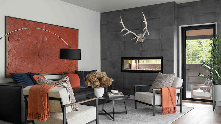 living room with modern furnishings and splashes of pumpkin accents