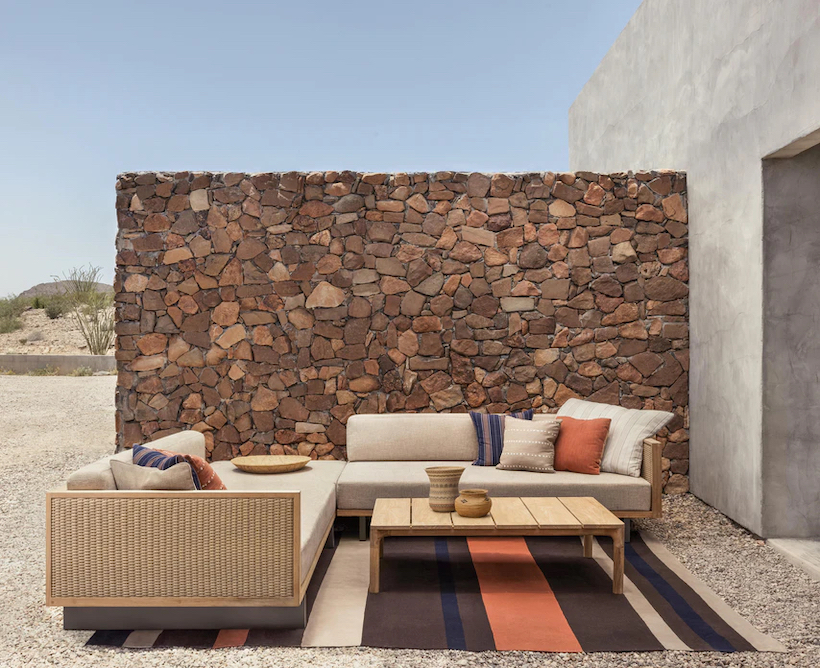 a striped outdoor rug in desert-styled outdoor space