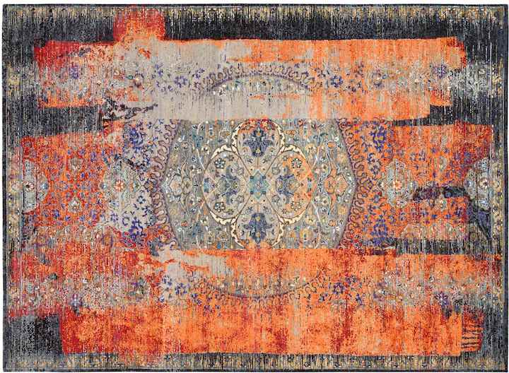 layered rug design pairing erased classic motif and abstract design in orange and black
