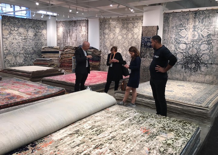 buyers in an area rug showroom