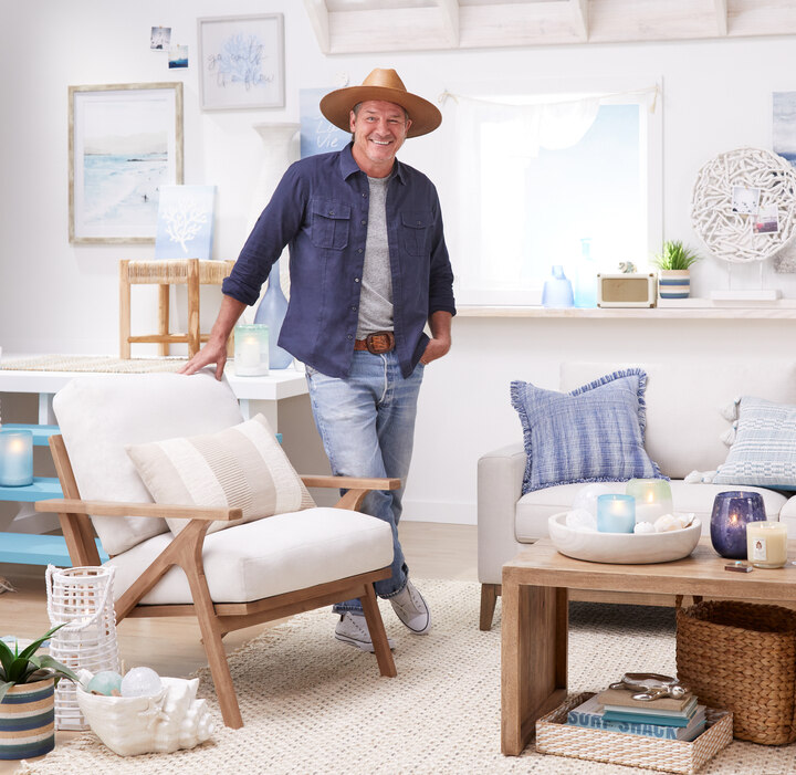 Tv host ty Pennington in room furnished with his designs