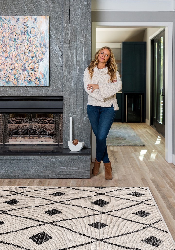 Bargain Mansion star tamara day standing by her moroccan style Juniper rug by Kaleen