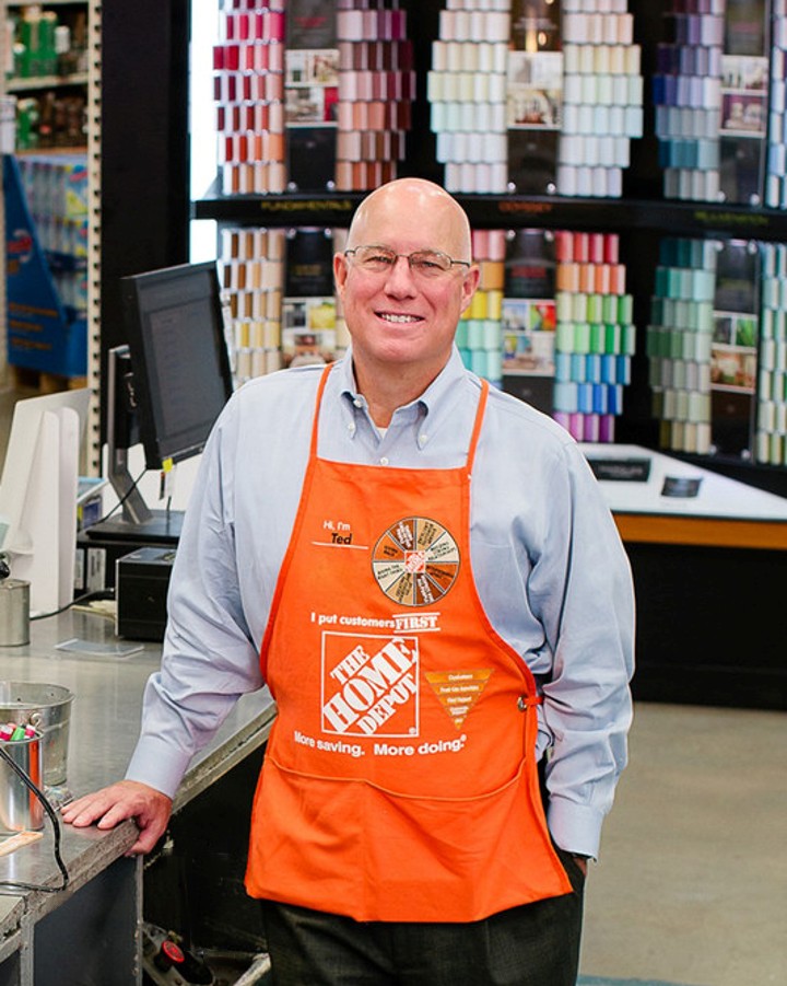 portrait of executive in Home Depot apron