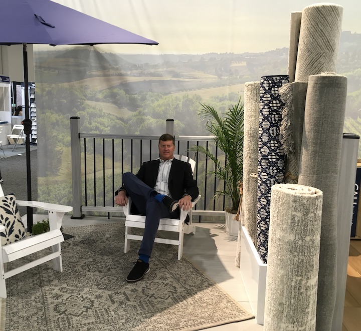 exec bob fish sits in a display featuring new indoor outdoor area rugs