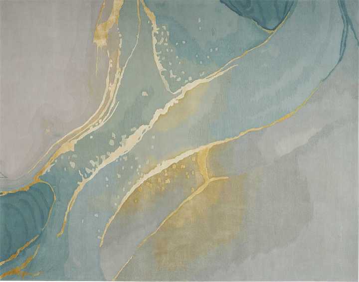 an Nourison abstract design in soft green gray with gold details