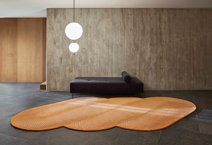 GAN's Optical Art spiral pattern shaped rug in orange