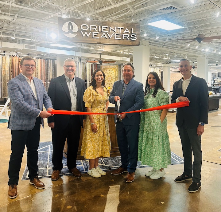 The OW team cutting the ribbon of its renovated High Point showroom