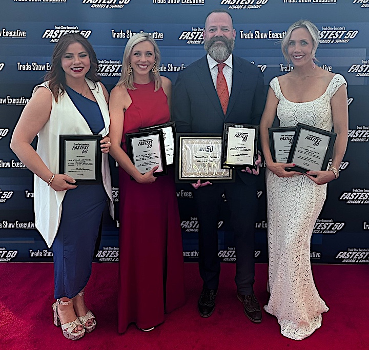 IMC Execs pose with awards