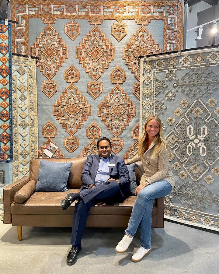 Kaleen COO Monty Rathi and TV celeb Tamara Day in front of her rugs