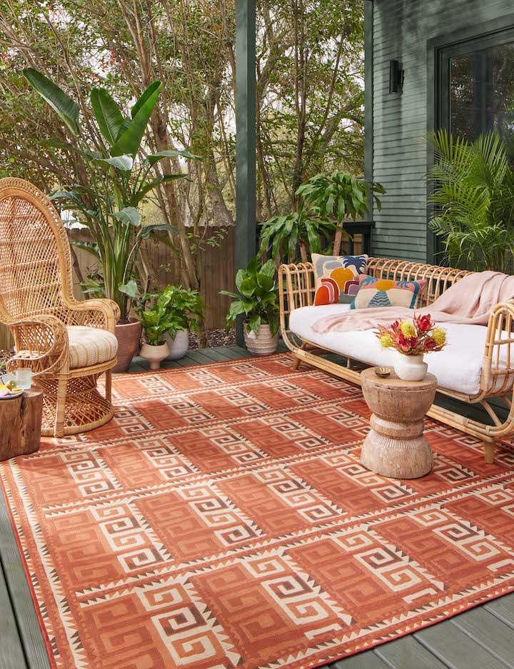 a rust-colored tribal style geometric rug from the Justina Blakeney by Loloi Ari collection