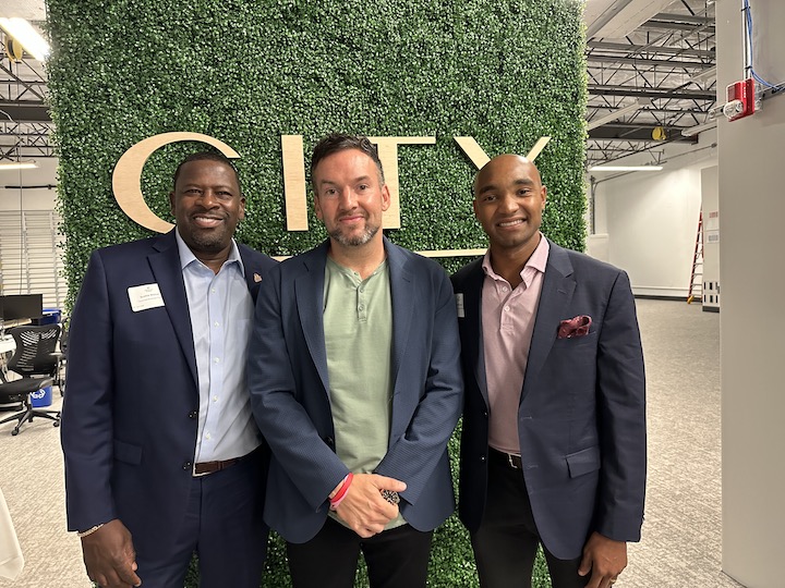 Image of Andrew Koenig, CEO, CITY Furniture, with Coca Cola's Scottie Walker and John Mitchell at summit