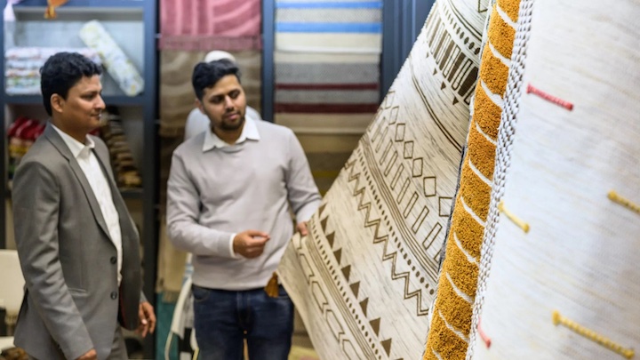 image of heimtextil buyer reviewing rug