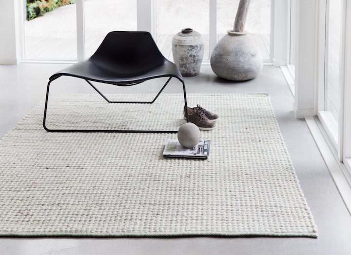 Tisca's hand-woven Scandinavian style Olbia rug shown in living room display