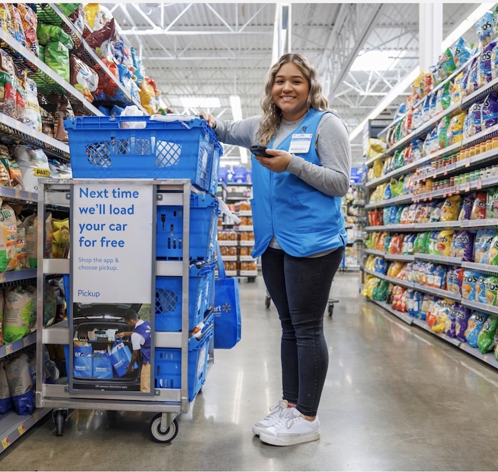 Walmart store employee fulfilling orders